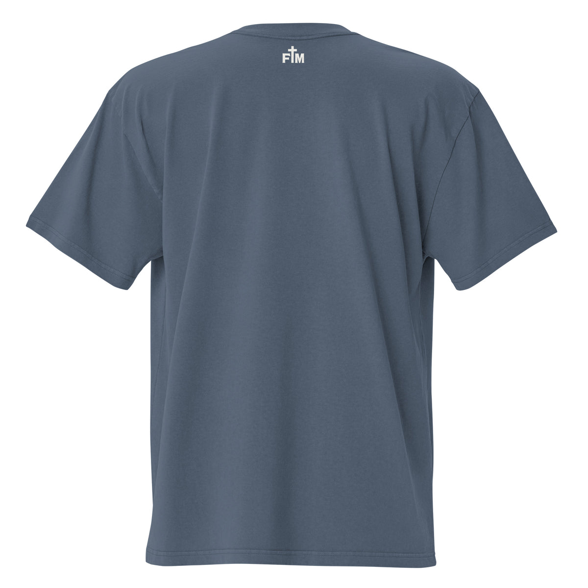 Small cream white "FM" Faith Mode logo printed on the upper back neck of a faded-indigo oversized tee