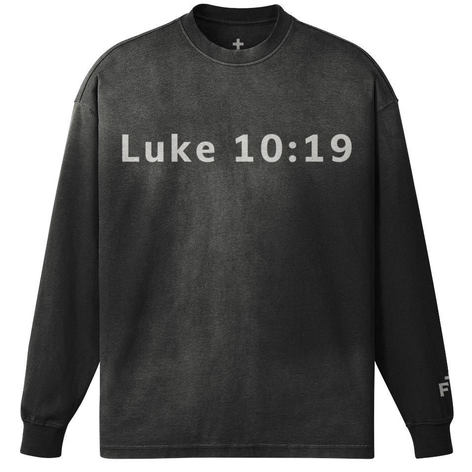 Black long-sleeve shirt with 'Luke 10:19' printed on a white background