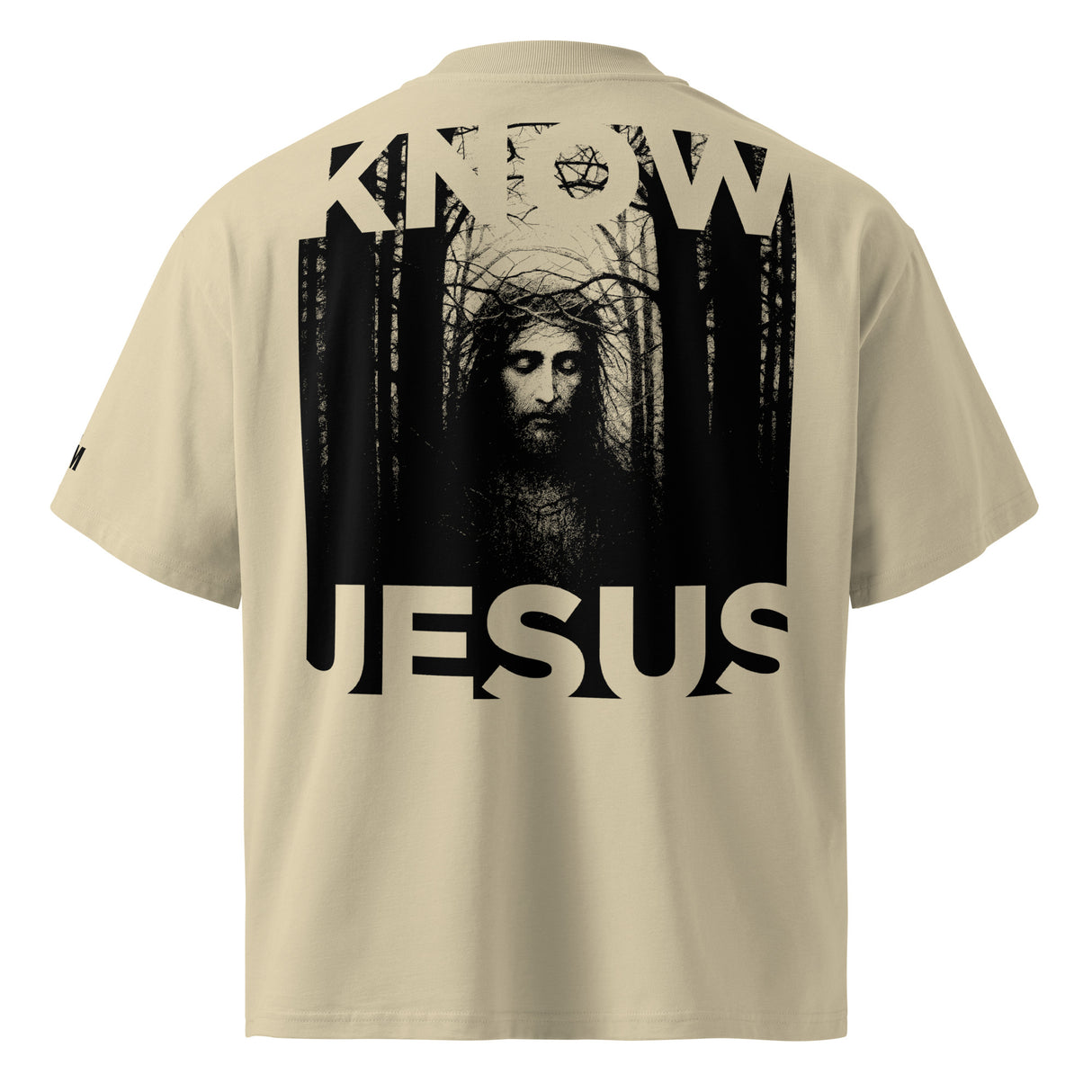 Beige t-shirt with a graphic of a person in a forest and the word 'Jesus' on the back.