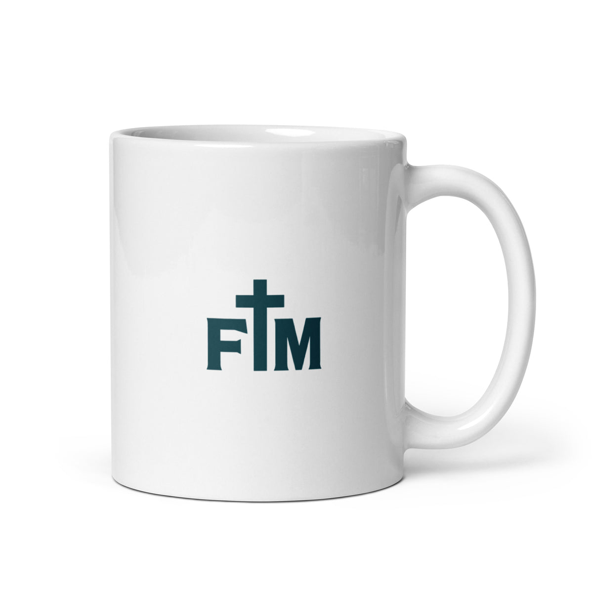 A white ceramic coffee mug with a dark teal 'FM' Faith Mode logo featuring a cross on the front, set against a plain white background.