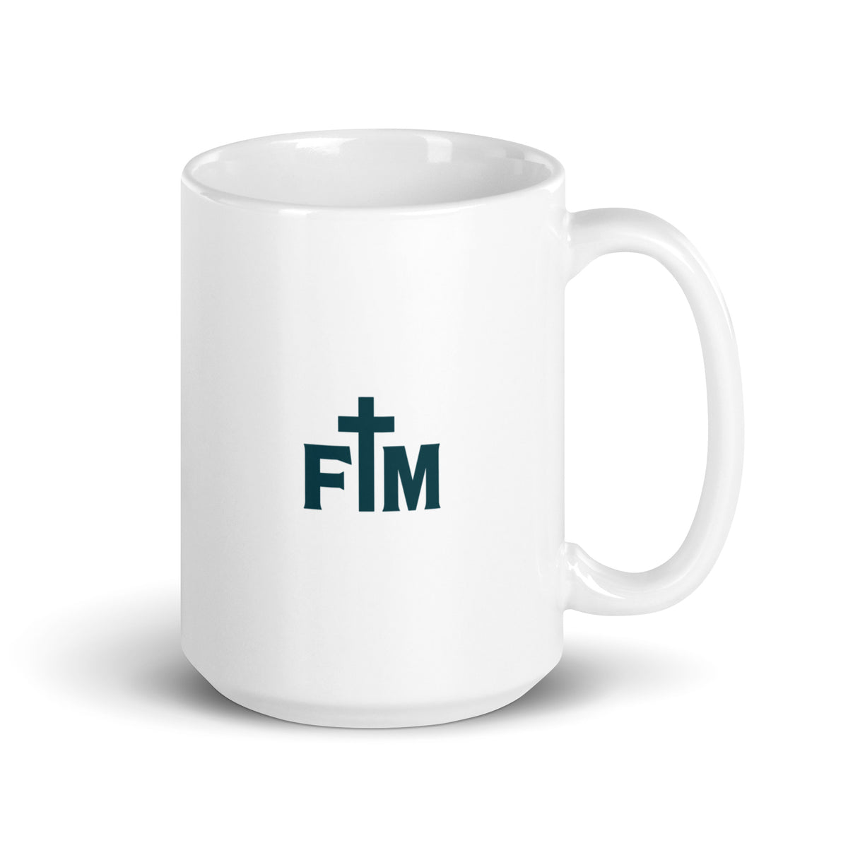 A white ceramic coffee mug with a dark teal 'FM' Faith Mode logo featuring a cross on the front, set against a plain white background.