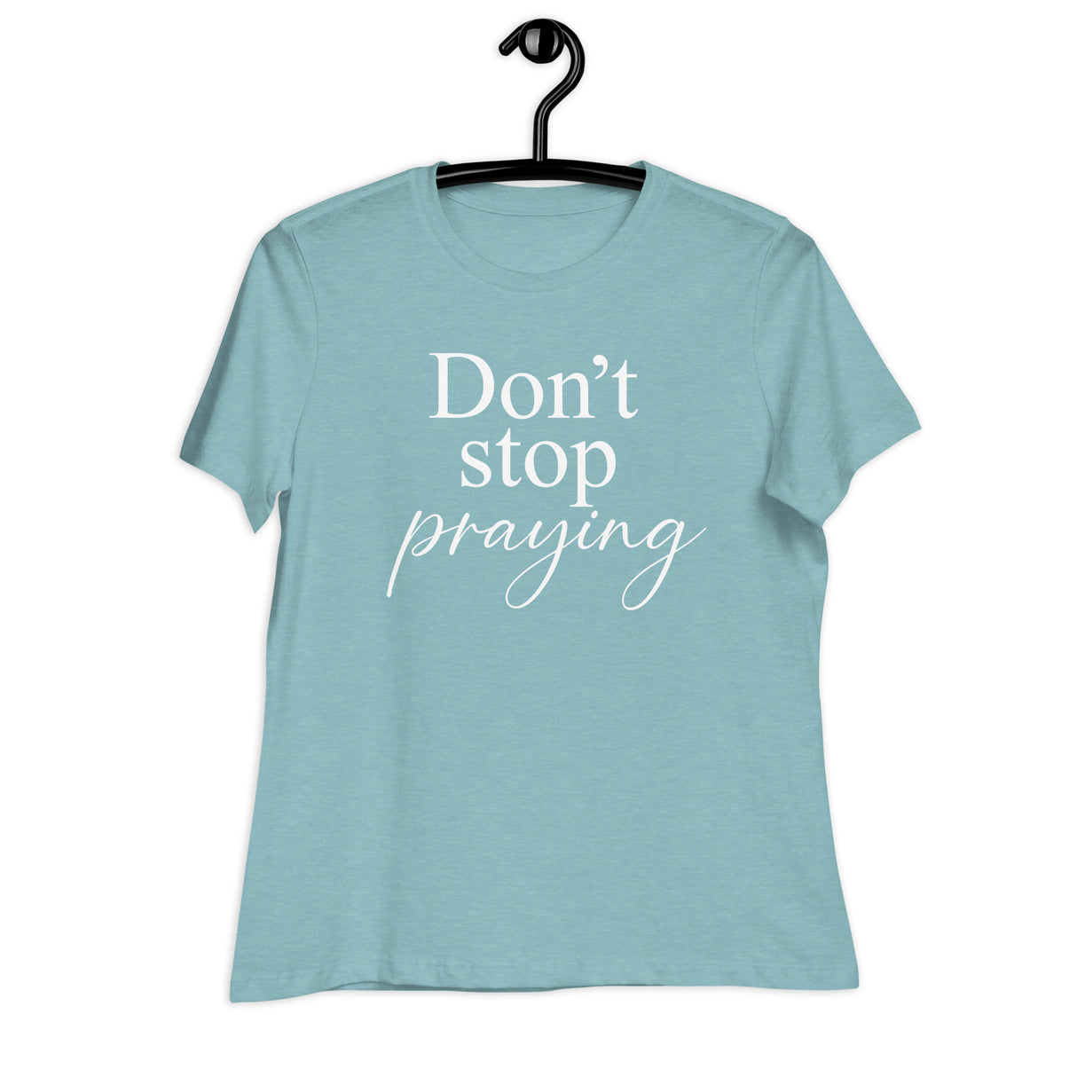 Light blue t-shirt with 'Don't stop praying' text on a hanger against a white background
