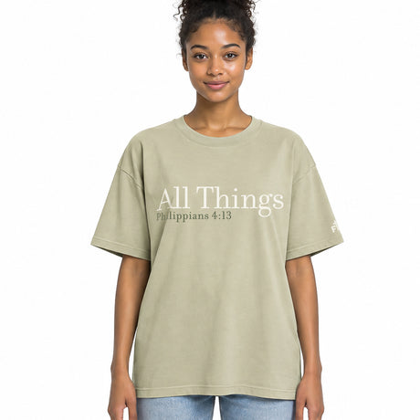 Front view of a Faded Eucalyptus oversized tee featuring cream All Things lettering, Philippians 4:13 beneath it, and a small Faith Mode logo on the left sleeve.