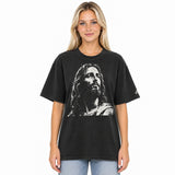 Front view of a faded-black oversized tee featuring a distressed cream artistic portrayal of Jesus and a small Faith Mode logo on the left sleeve.