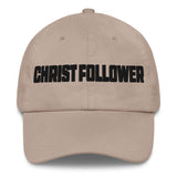 A beige baseball cap with the word 'CHRIST FOLLOWER' embroidered in bold black letters across the front, shown against a plain white background.