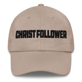 A beige baseball cap with the word 'CHRIST FOLLOWER' embroidered in bold black letters across the front, shown against a plain white background.