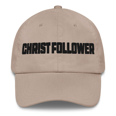 A beige baseball cap with the word 'CHRIST FOLLOWER' embroidered in bold black letters across the front, shown against a plain white background.