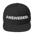 Black cap with 'ANSWERED.' text on a white background