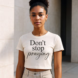 Woman wearing Faith Mode's Don't Stop Praying Crop Top