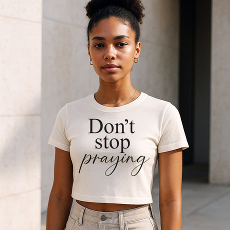 Woman wearing Faith Mode's Don't Stop Praying Crop Top
