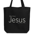 "But first, Jesus Matthew 6:33" in cream white lettering on a black Eco tote bag