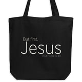 "But first, Jesus Matthew 6:33" in cream white lettering on a black Eco tote bag