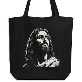 Black eco tote bag featuring a distressed cream-white artistic portrait of Jesus looking upward.
