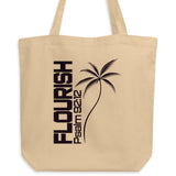 Natural oyster-colored eco tote bag with a dark Flourish Psalm 92:12 design and minimalist palm tree graphic.