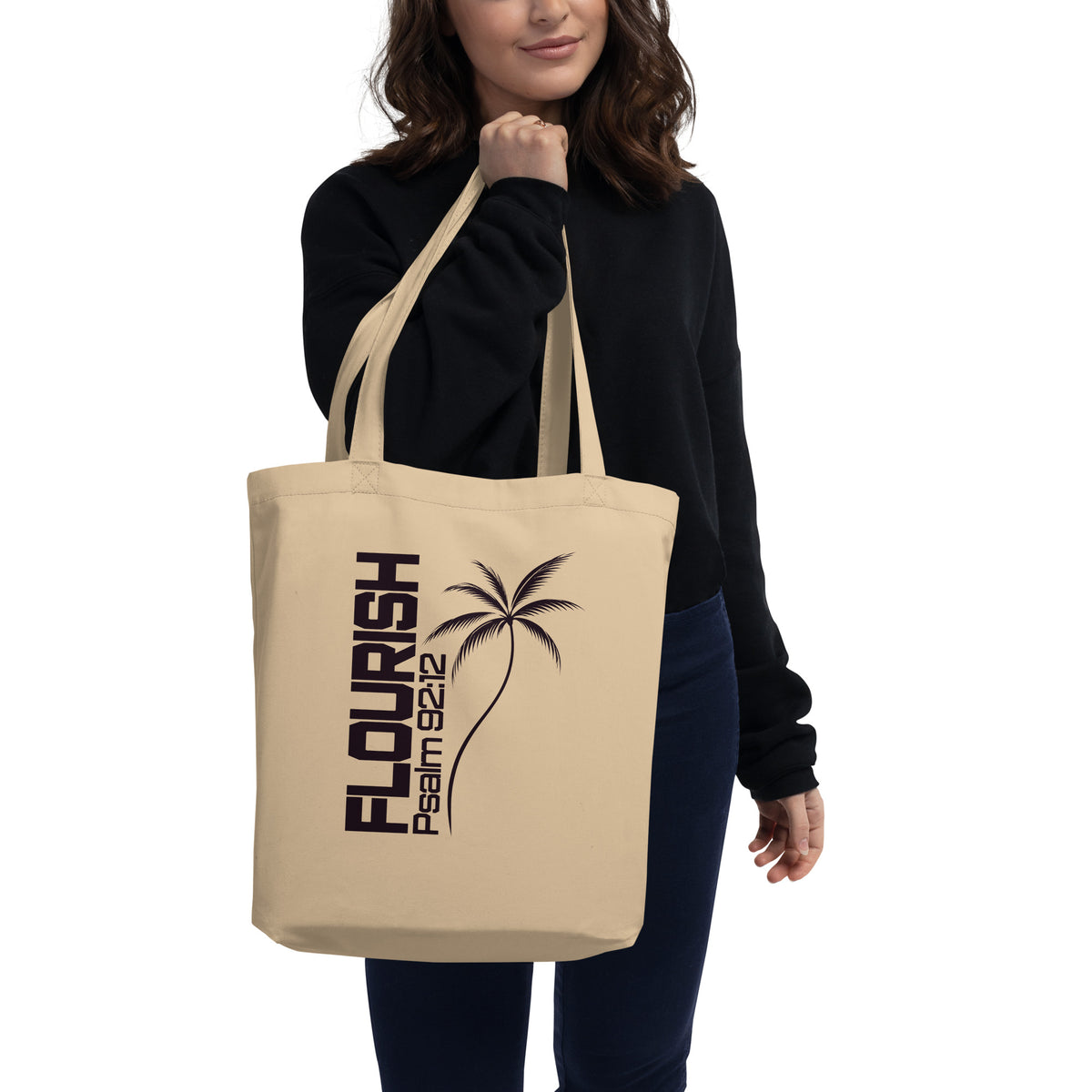 Natural oyster-colored eco tote bag with a dark Flourish Psalm 92:12 design and minimalist palm tree graphic.