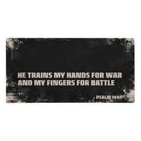 Large gaming mouse pad, black with cream distressing showing the scripture "He trains my hands for war and my fingers for battle, Psalm 144:1"