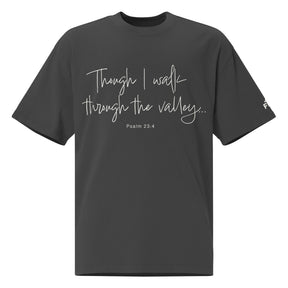 Front view of a Faded Black oversized tee featuring Though I Walk Through the Valley in cream script, Psalm 23:4, and a small Faith Mode sleeve logo.