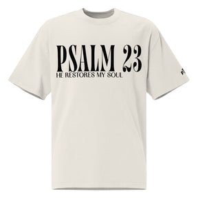 Front view of a faded bone oversized tee featuring black PSALM 23 lettering with He Restores My Soul underneath and a small Faith Mode logo on the sleeve.