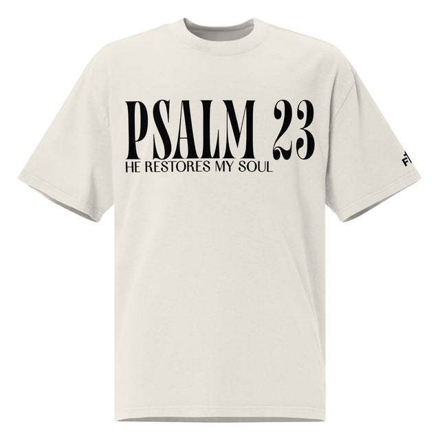 Front view of a faded bone oversized tee featuring black PSALM 23 lettering with He Restores My Soul underneath and a small Faith Mode logo on the sleeve.