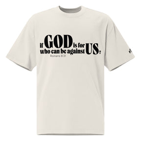Front view of a faded bone oversized tee featuring black If God Is for Us Who Can Be Against Us lettering, Romans 8:31, and a small Faith Mode sleeve logo.