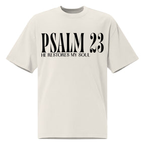 Front view of a faded bone oversized tee featuring black PSALM 23 lettering with He Restores My Soul underneath