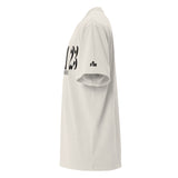 Black Faith Mode logo on left sleeve of bone-colored oversized tee