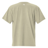 Small cream white "FM" Faith Mode logo printed on the upper back neck of a faded-eucalyptus oversized tee