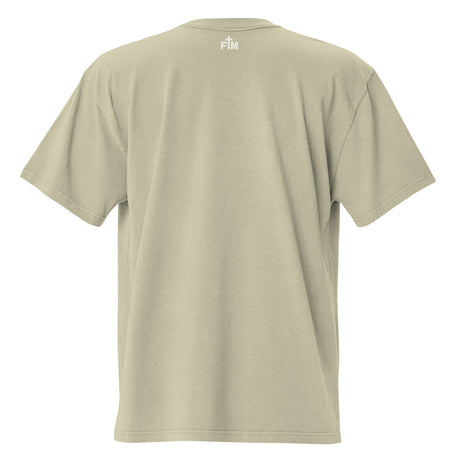 Small cream white "FM" Faith Mode logo printed on the upper back neck of a faded-eucalyptus oversized tee