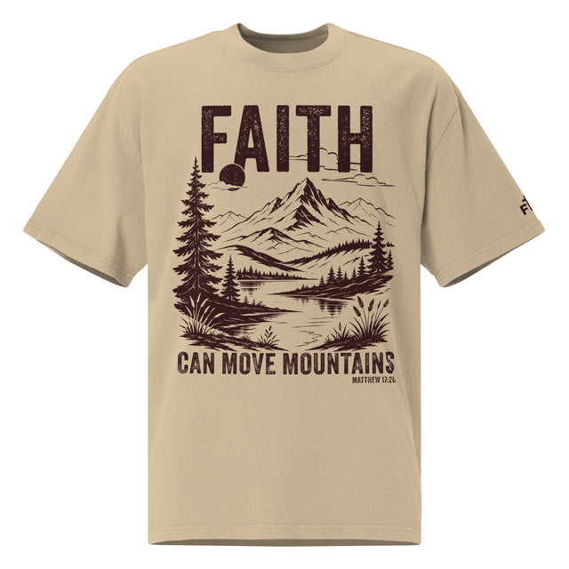 Front view of a Faded Khaki oversized tee featuring deep plum Faith Can Move Mountains lettering, a mountain and lake illustration, Matthew 17:20, and a small sleeve logo.