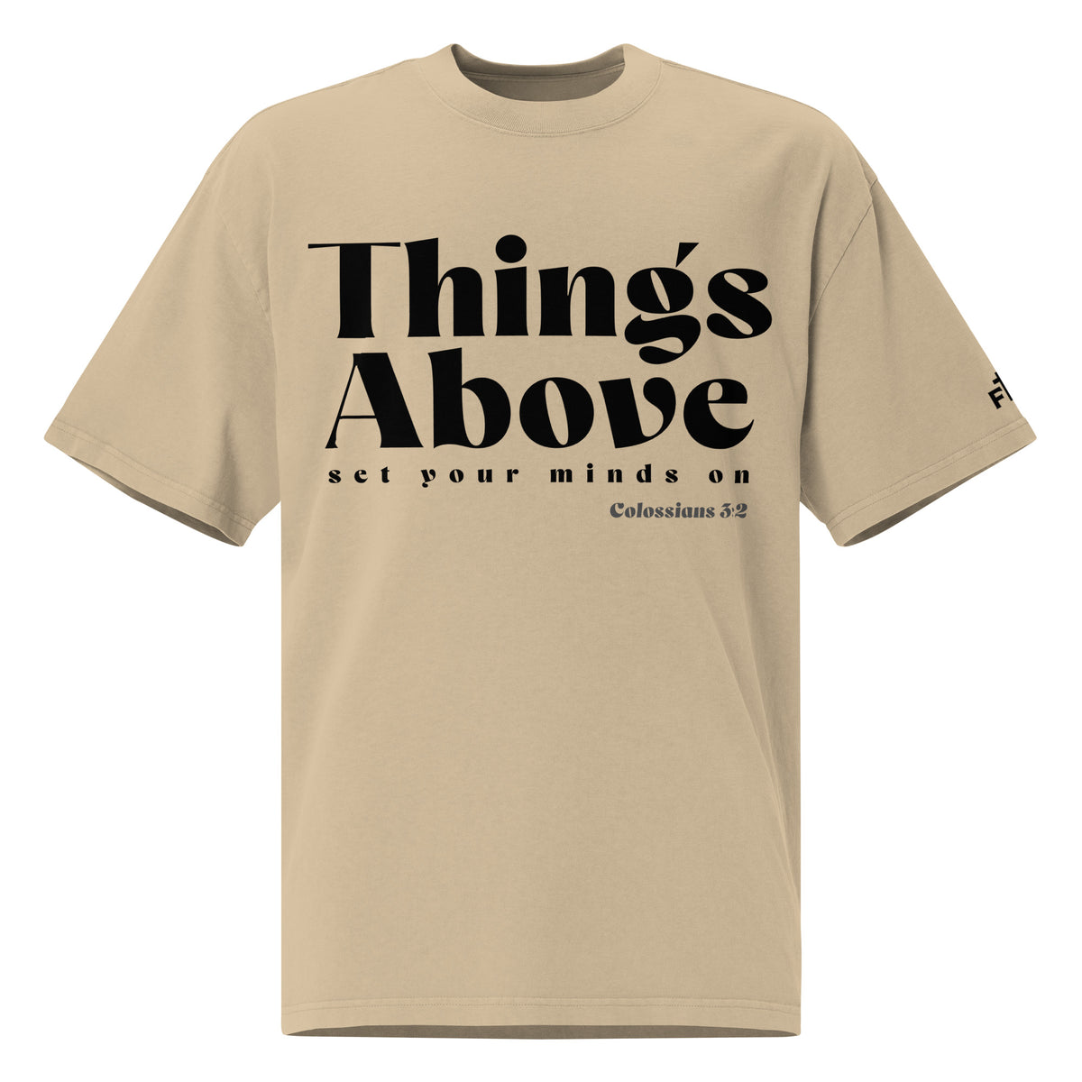 Front view of a Faded Khaki oversized tee featuring black Things Above and Set Your Minds On lettering, Colossians 3:2, and a small Faith Mode sleeve logo.