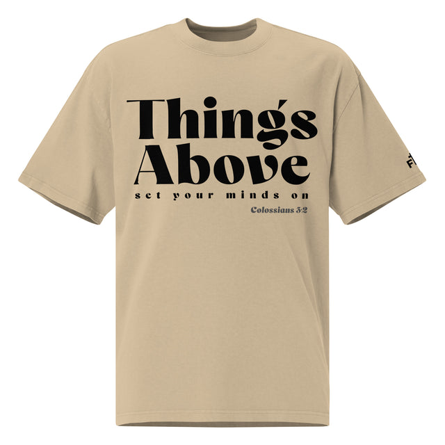 Front view of a Faded Khaki oversized tee featuring black Things Above and Set Your Minds On lettering, Colossians 3:2, and a small Faith Mode sleeve logo.