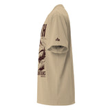 Side view of a Faded Khaki oversized tee featuring deep plum Faith Can Move Mountains lettering, a mountain and lake illustration, Matthew 17:20, and a small sleeve logo.