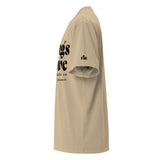 Side view of a Faded Khaki oversized tee featuring black Things Above and Set Your Minds On lettering, Colossians 3:2, and a small Faith Mode sleeve logo.