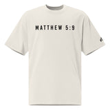 White t-shirt with 'MATTHEW 5:9' printed on a white background