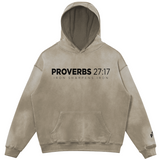 Beige hoodie with 'Proverbs 27:17' text on a white background