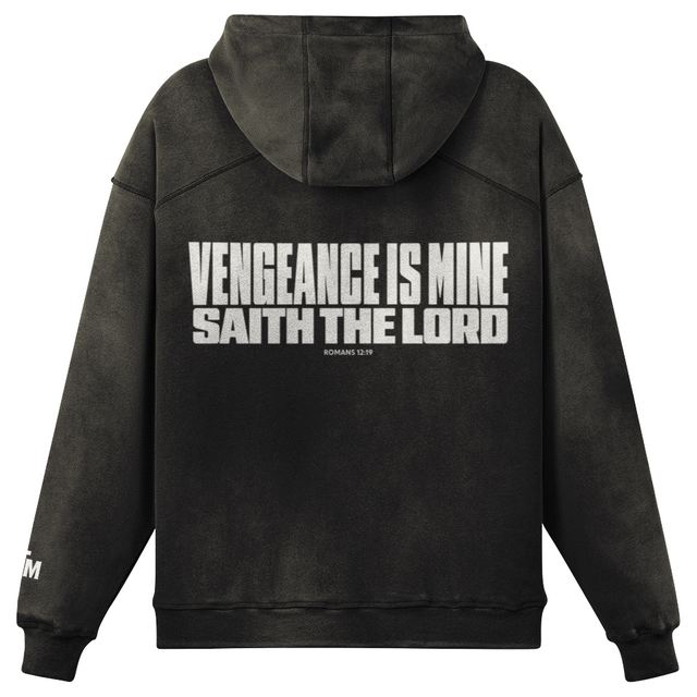 Black hoodie with "Vengeance is Mine" in white typography. White background.