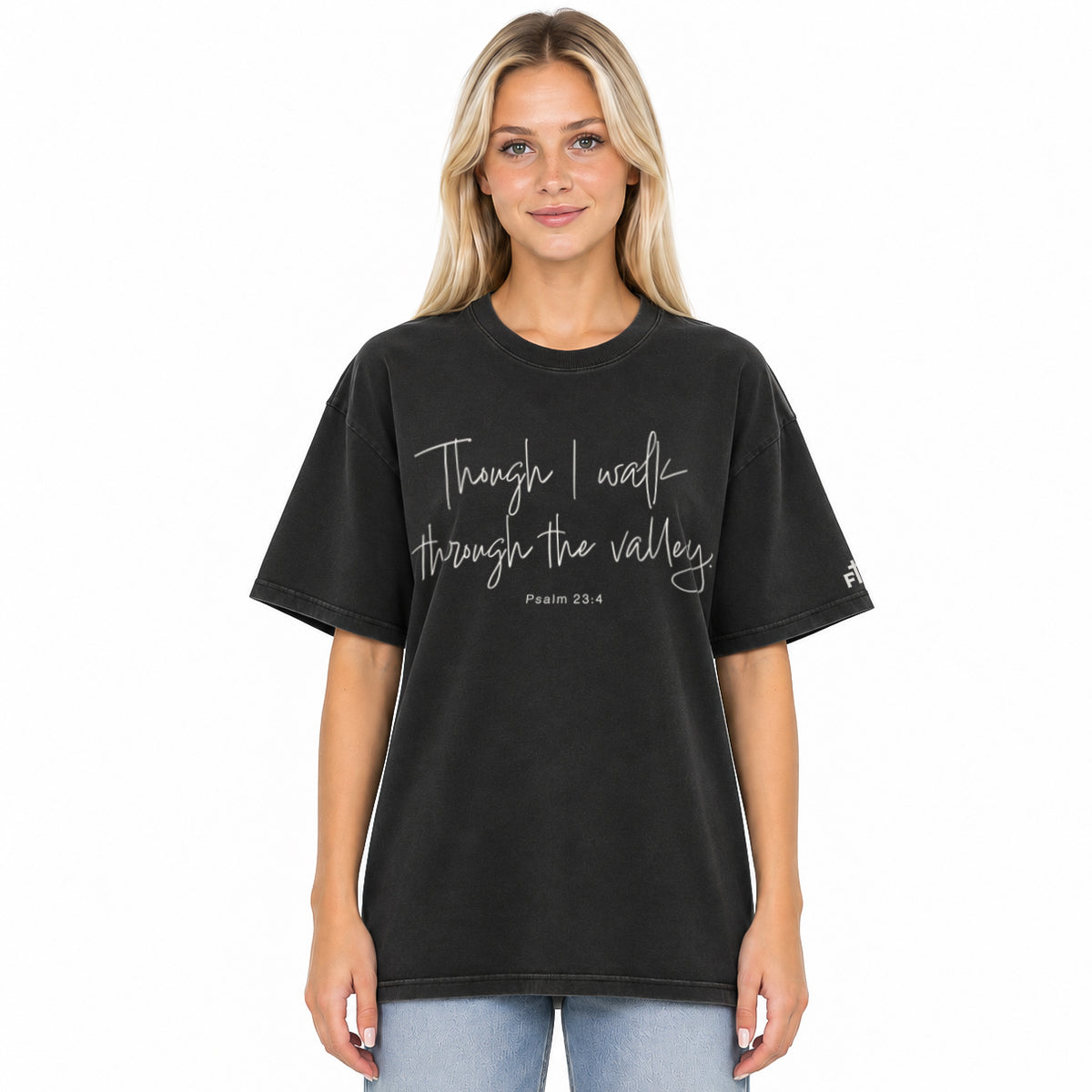 Front view of a Faded Black oversized tee featuring Though I Walk Through the Valley in cream script, Psalm 23:4, and a small Faith Mode sleeve logo.
