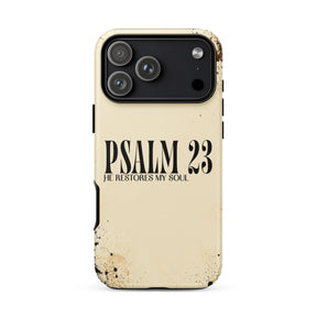 A cream-colored phone case with a distressed, weathered finish, featuring the text 'PSALM 23 HE RESTORES MY SOUL' printed in black. The case is shown on a clean white background.