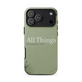 An olive green phone case with a distressed, weathered texture and black speckles, featuring the text 'All Things Philippians 4:13' in white. The case is shown on a plain white background.