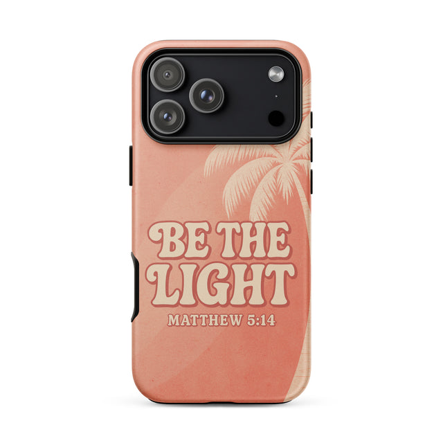 A peach-colored phone case featuring a tropical palm tree design and the text 'BE THE LIGHT MATTHEW 5:14' in a retro cream font, shown on a plain white background.