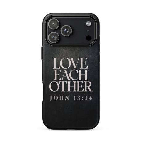 A black protective phone case featuring the text 'LOVE EACH OTHER JOHN 13:34' in a distressed white serif font, shown on a plain white background.
