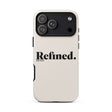 A cream-colored phone case with a black camera bar and the word 'Refined.' printed in black on the back, shown on a plain white background.