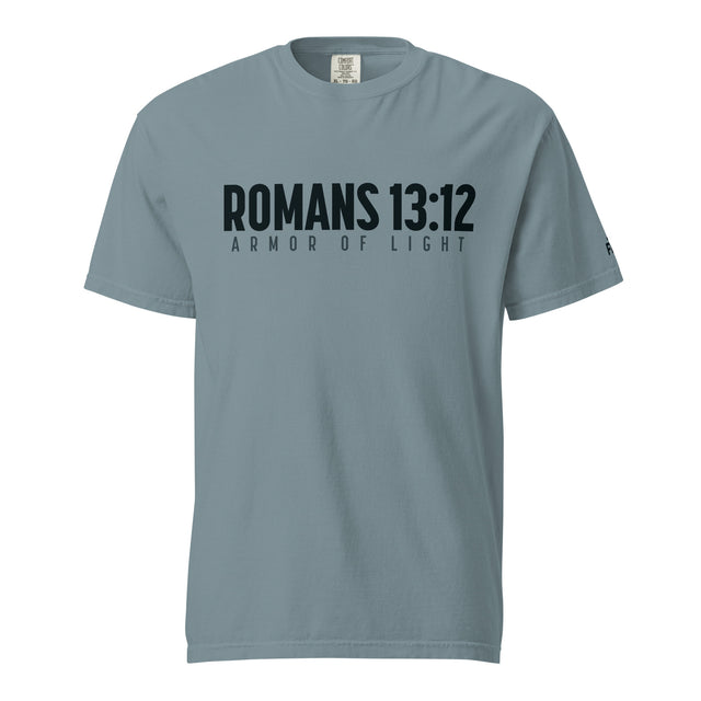A slate blue short-sleeve t-shirt with 'ROMANS 13:12' and 'ARMOR OF LIGHT' printed in black across the chest, displayed on a clean white background.