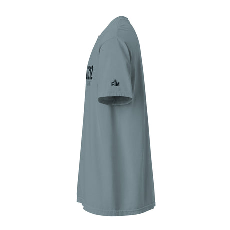 A slate blue-gray short-sleeve athletic t-shirt shown from a side profile view against a solid white background. The shirt features black printed text on the left chest and a small black logo on the right sleeve.