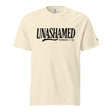 A cream-colored short-sleeve t-shirt with 'UNASHAMED ROMANS 1:16' printed in black across the chest, displayed on a solid white background.