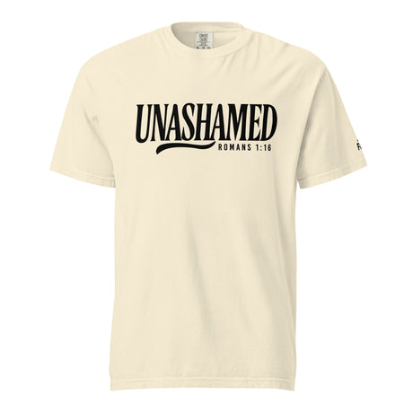 A cream-colored short-sleeve t-shirt with 'UNASHAMED ROMANS 1:16' printed in black across the chest, displayed on a solid white background.