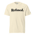 A cream-colored short-sleeve t-shirt with 'Refined.' printed in black serif font across the chest, accompanied by smaller text 'JOB 28:10' underneath, shown on a plain white background.