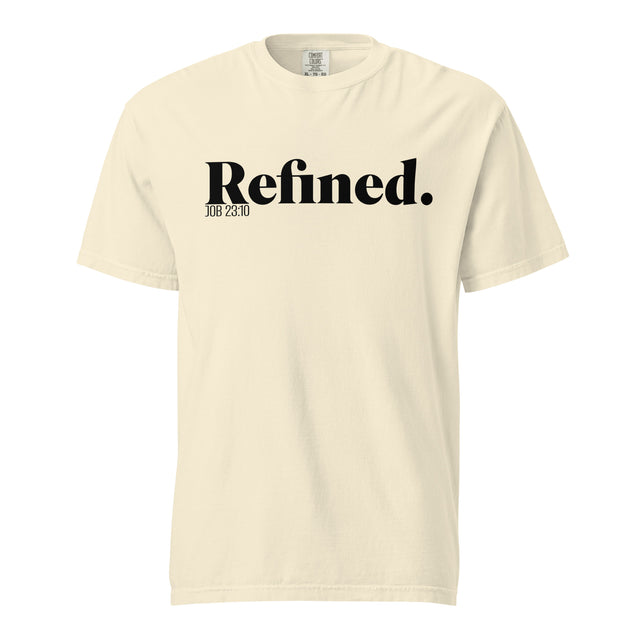 A cream-colored short-sleeve t-shirt with 'Refined.' printed in black serif font across the chest, accompanied by smaller text 'JOB 28:10' underneath, shown on a plain white background.