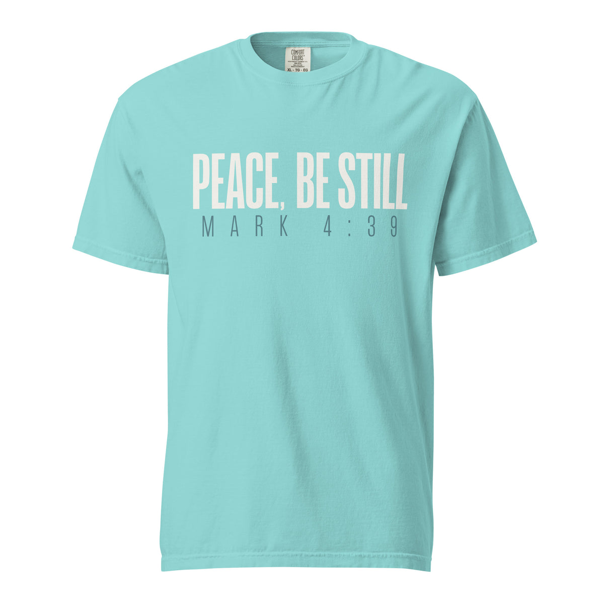 A light turquoise crewneck t-shirt with the text 'PEACE, BE STILL' and 'MARK 4:39' printed on the chest in a pale cream and dark gray font, shown against a plain white background.
