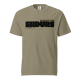 Front view of a sand-colored unisex T-shirt with a bold black “ENDURE” graphic. Smaller text reads “Like a good soldier of Christ” above the design and “2 Timothy 2:3” below.